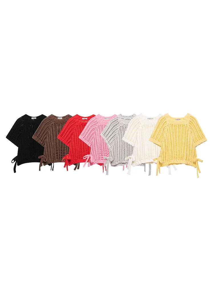 Set of six colorful knit tops arranged in a row on a white background