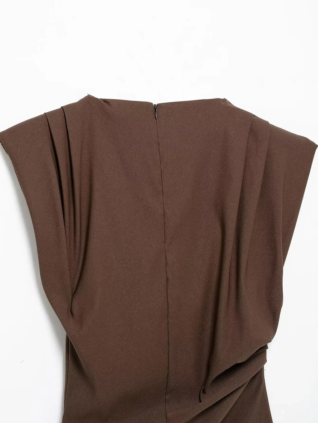 Brown sleeveless top on a white background