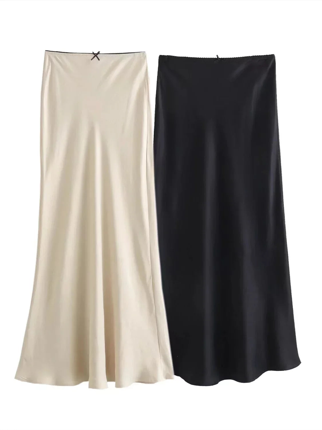 Two satin skirts, one beige and one black, on a white background with 'TRAF' branding.