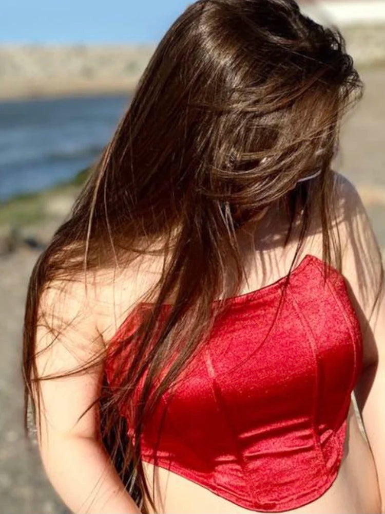 Woman in a red top with a blurred background