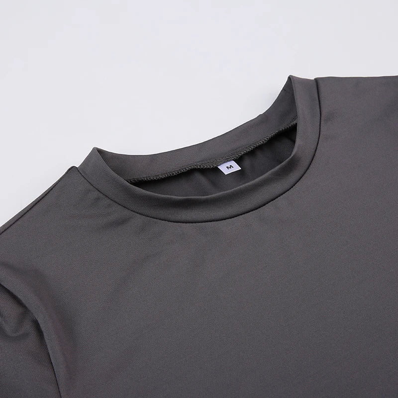 Gray t-shirt with a close-up of the collar on a light gray background