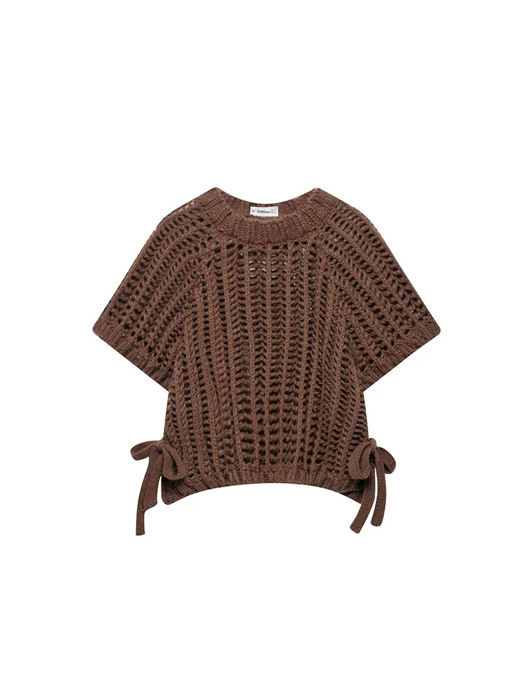 Brown knitted poncho on a white background