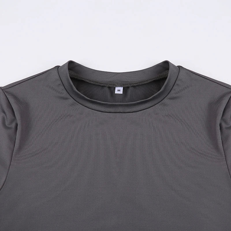 Gray t-shirt with a brand label on a light gray background