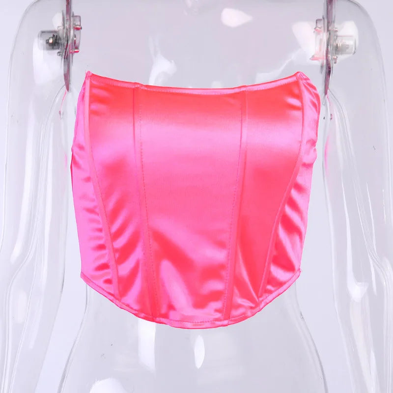 Neon pink swimsuit bottom on a clear mannequin