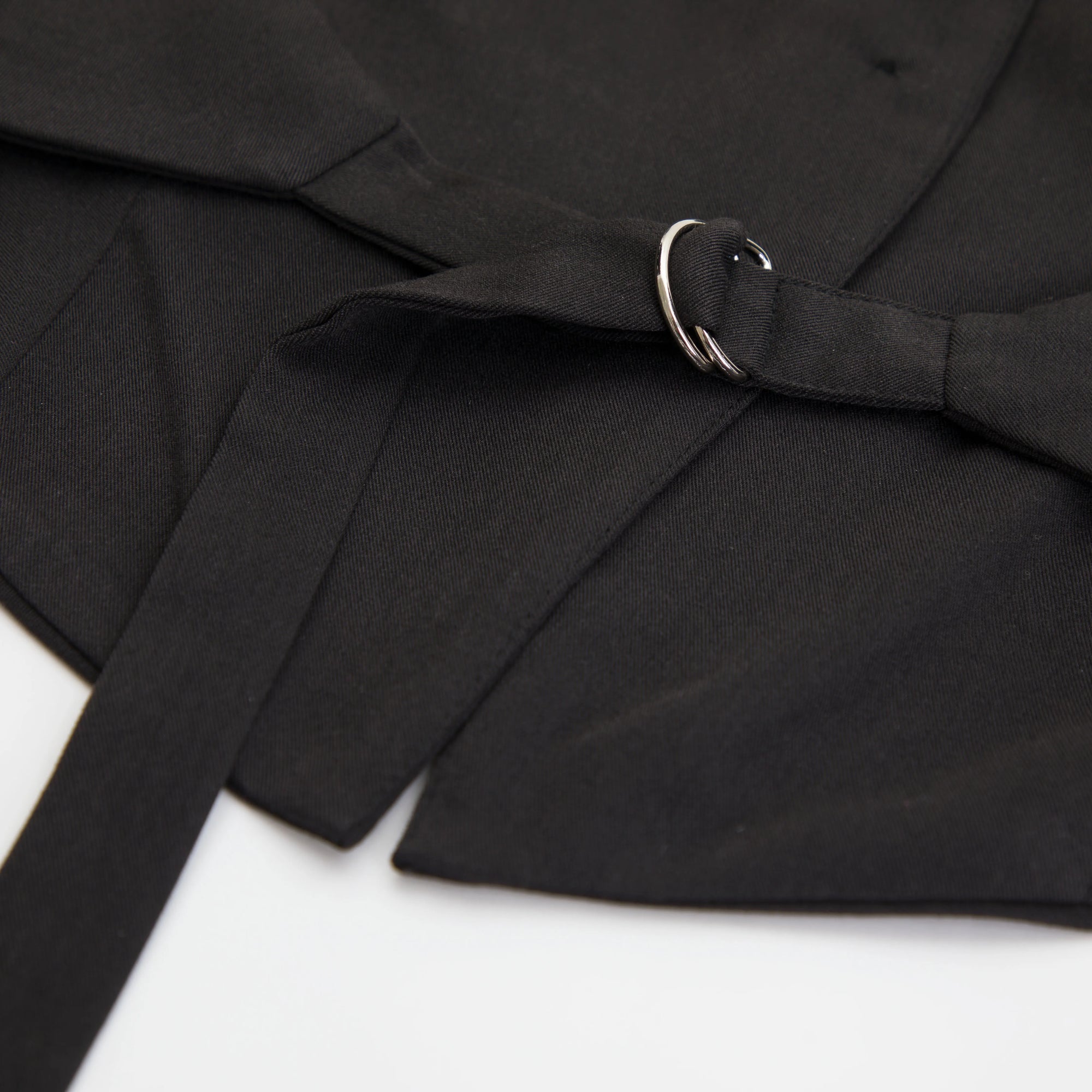 Black belt with a silver buckle on a white background