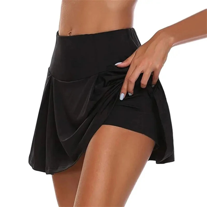 Black skirt worn by a person on a white background