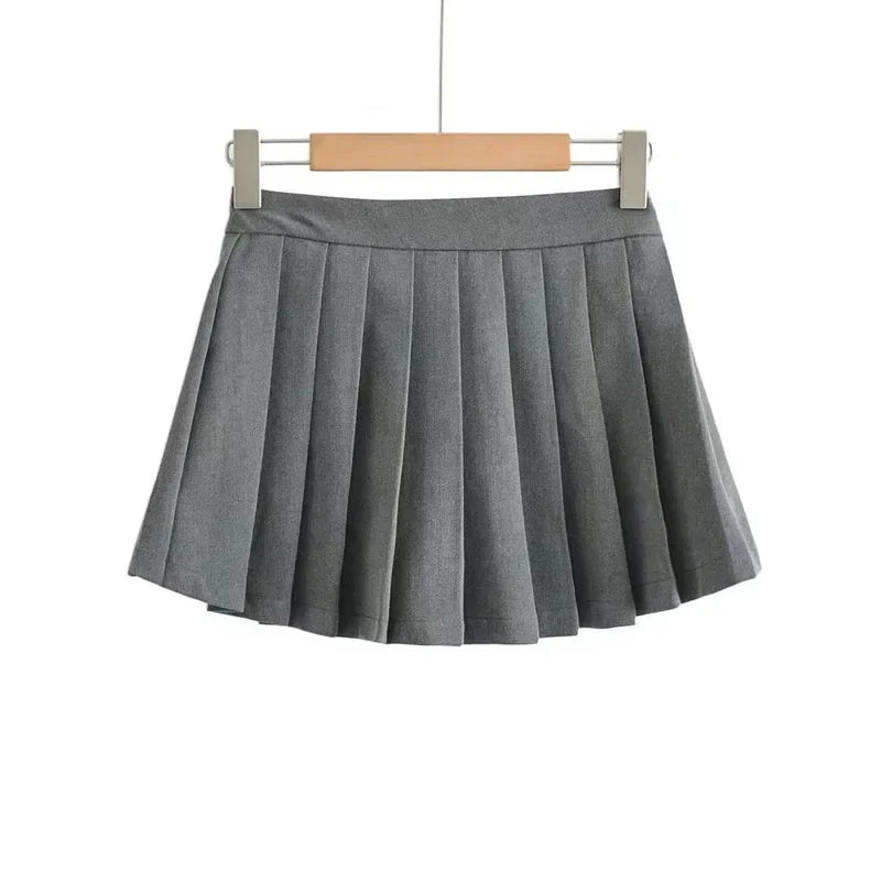 Gray pleated skirt on a hanger against a white background