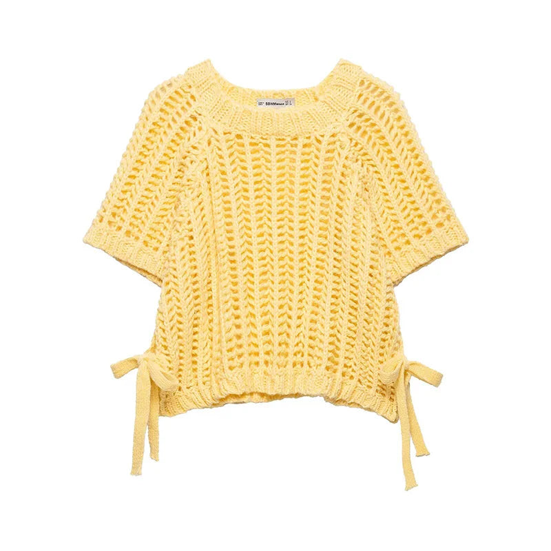 Yellow knitted top with tie details on a white background