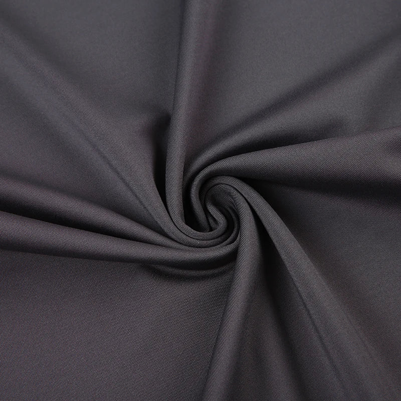 Close-up of dark gray fabric with a swirl pattern