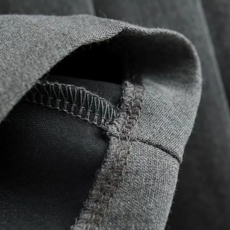 Close-up of gray fabric with stitching detail