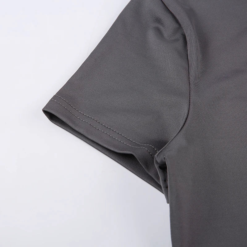 Close-up of a gray t-shirt sleeve on a white background