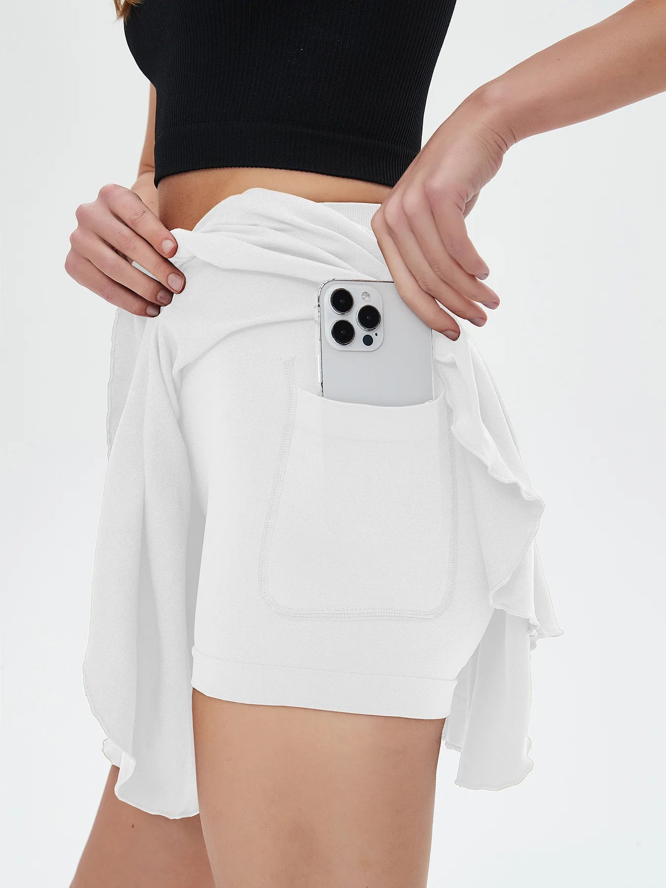 White shorts with a phone case in the pocket on a white background - RemarkStore