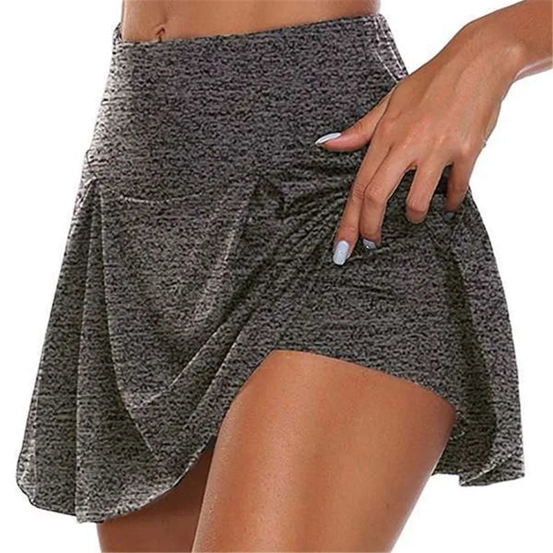 Gray patterned skirt worn by a person on a white background